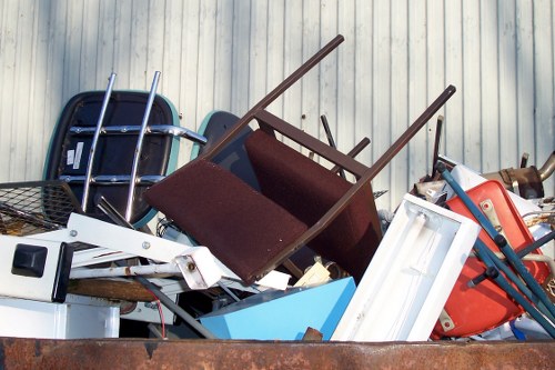 Operatives sorting recyclable items at a house clearance in Tottenham